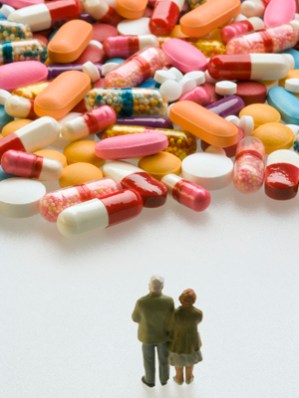 Senior couple with capsules and pills